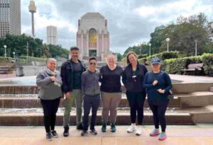 Image of Thang and SCS team members taking part in the 'Walk for a Refugee' initiative