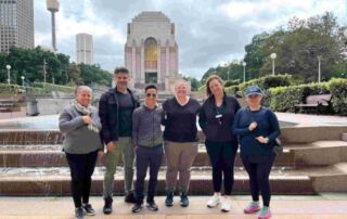 Image of Thang and SCS team members taking part in the 'Walk for a Refugee' initiative